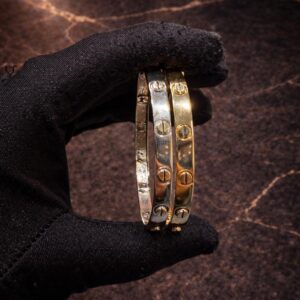 Begagnad Tvåfärgad armring i 18K guld - 2st.- 31.82g